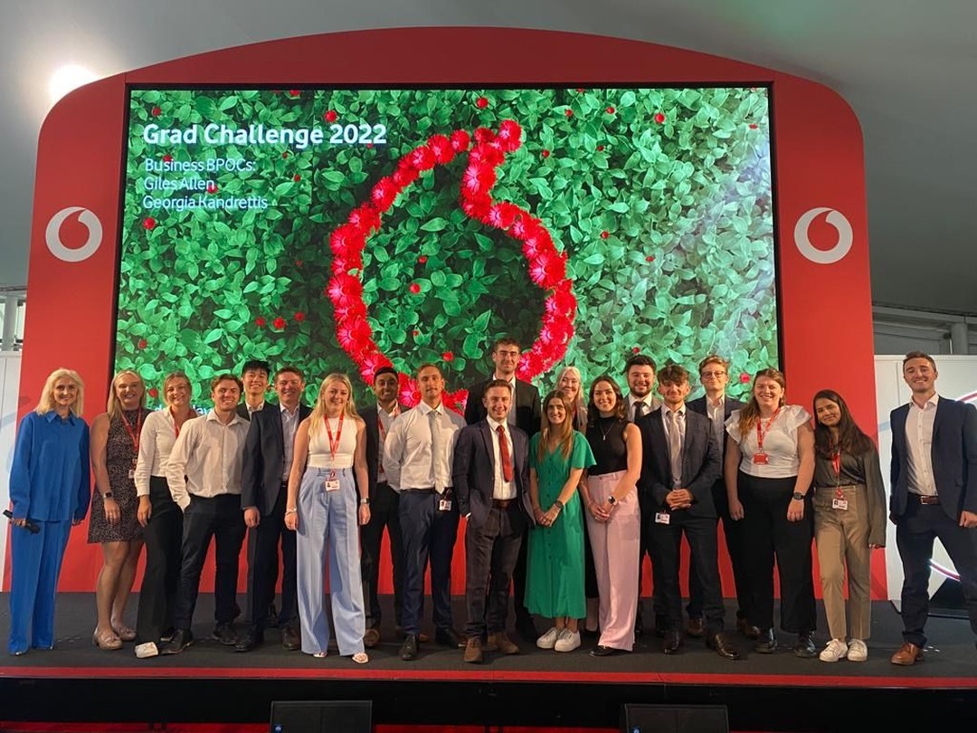 A group of business graduates on their presentations for the Grad Challenge