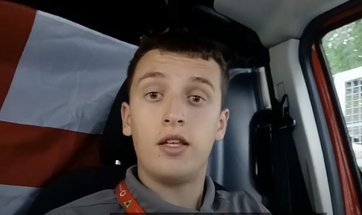 A man talking on video whilst being in a car