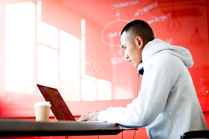 A man at a desk on a laptop