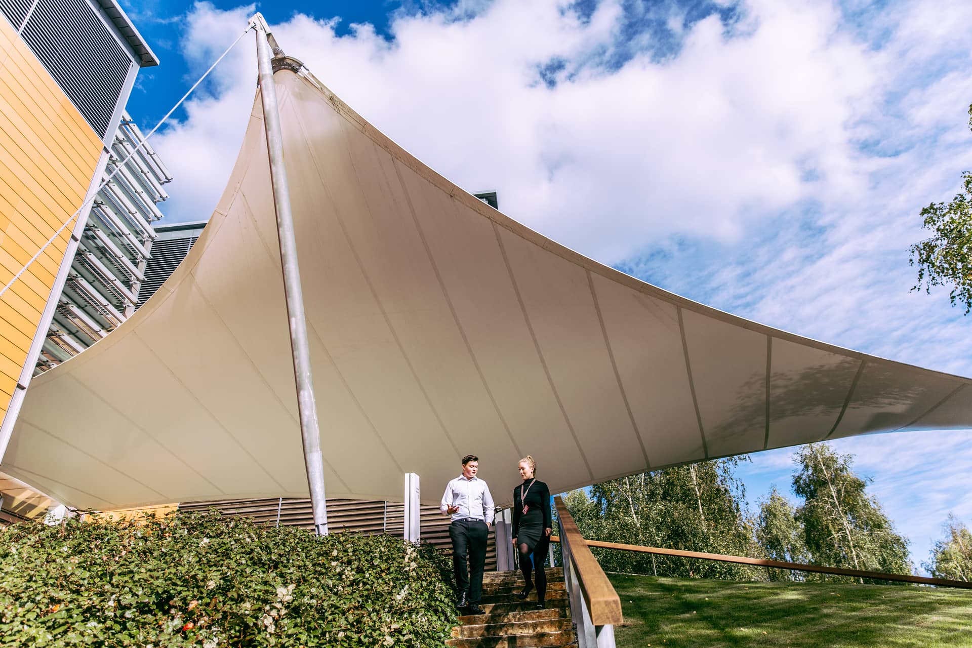 Two people outside on site at Newbury