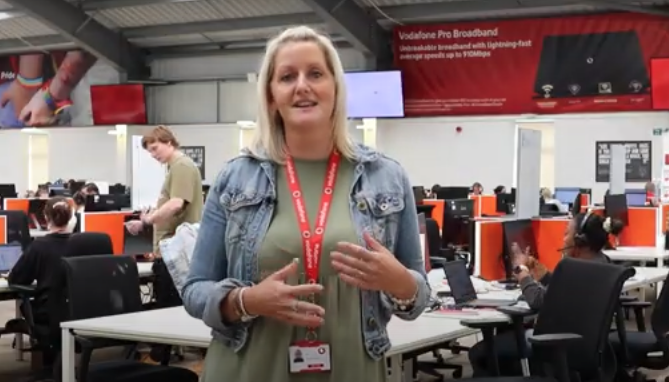 A woman talking in the inside of the Vodafone Stoke office