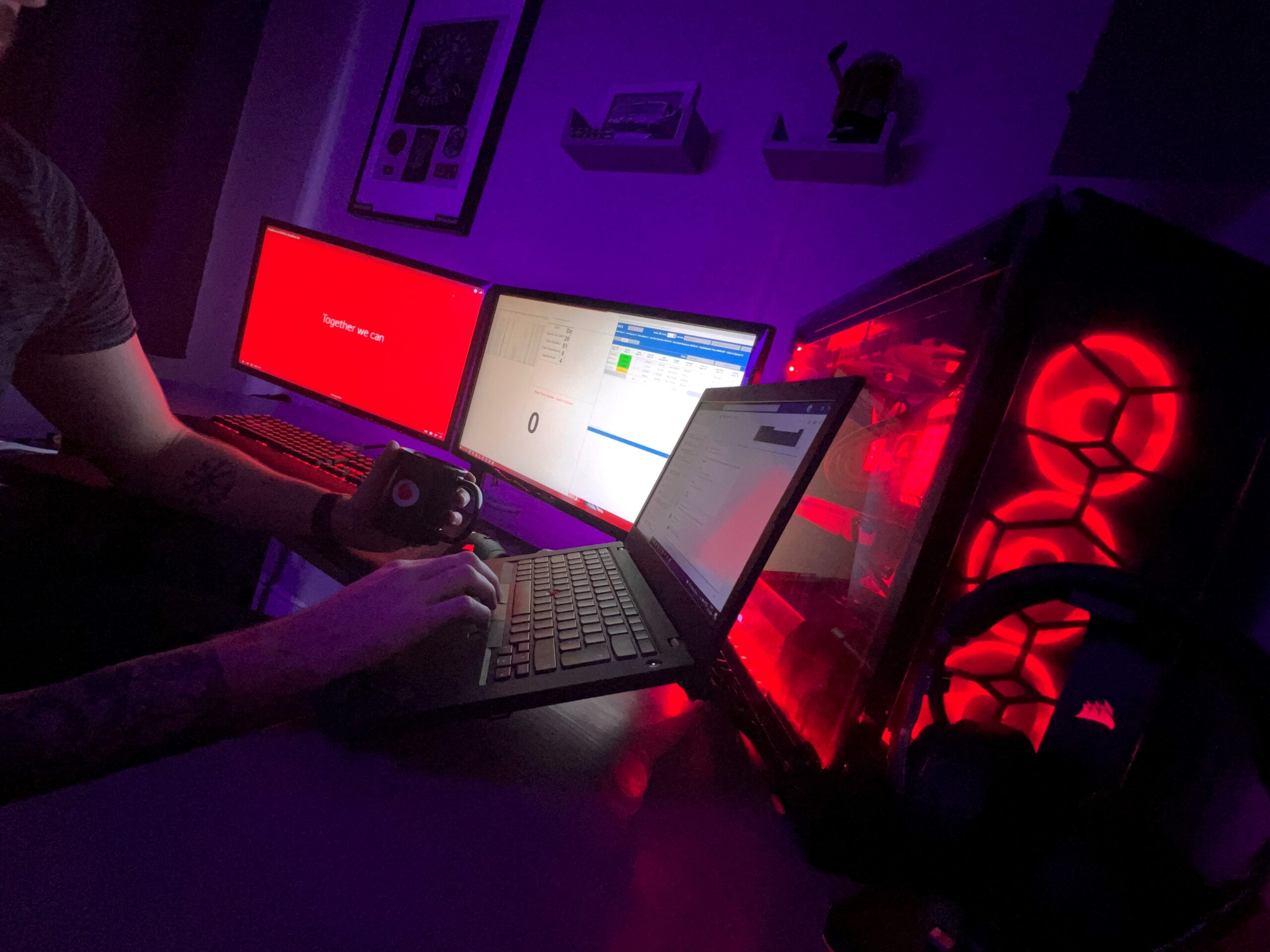 Image of a laptop in a dark red room