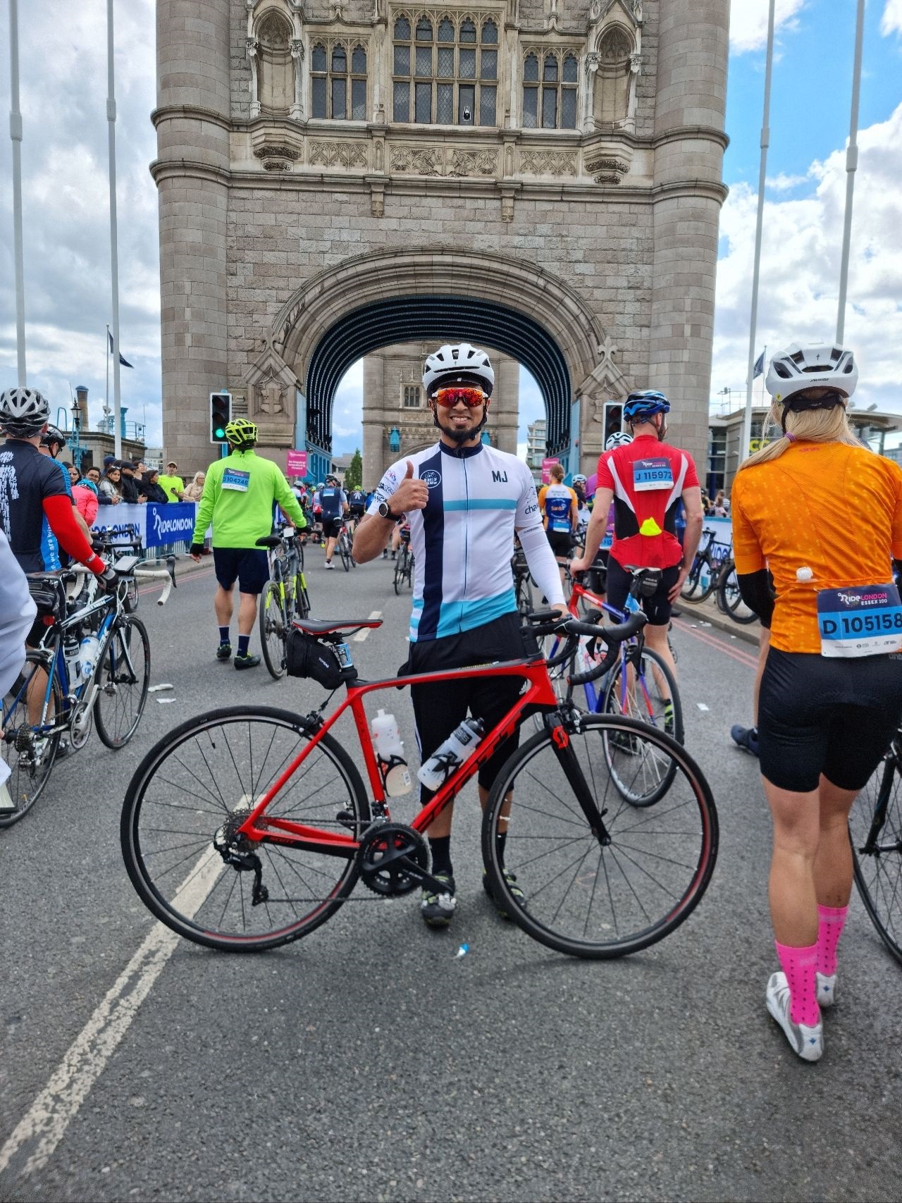 Man with a bike on Tower Bridge